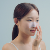 woman applying terez & honor blackhead remover nose patch
