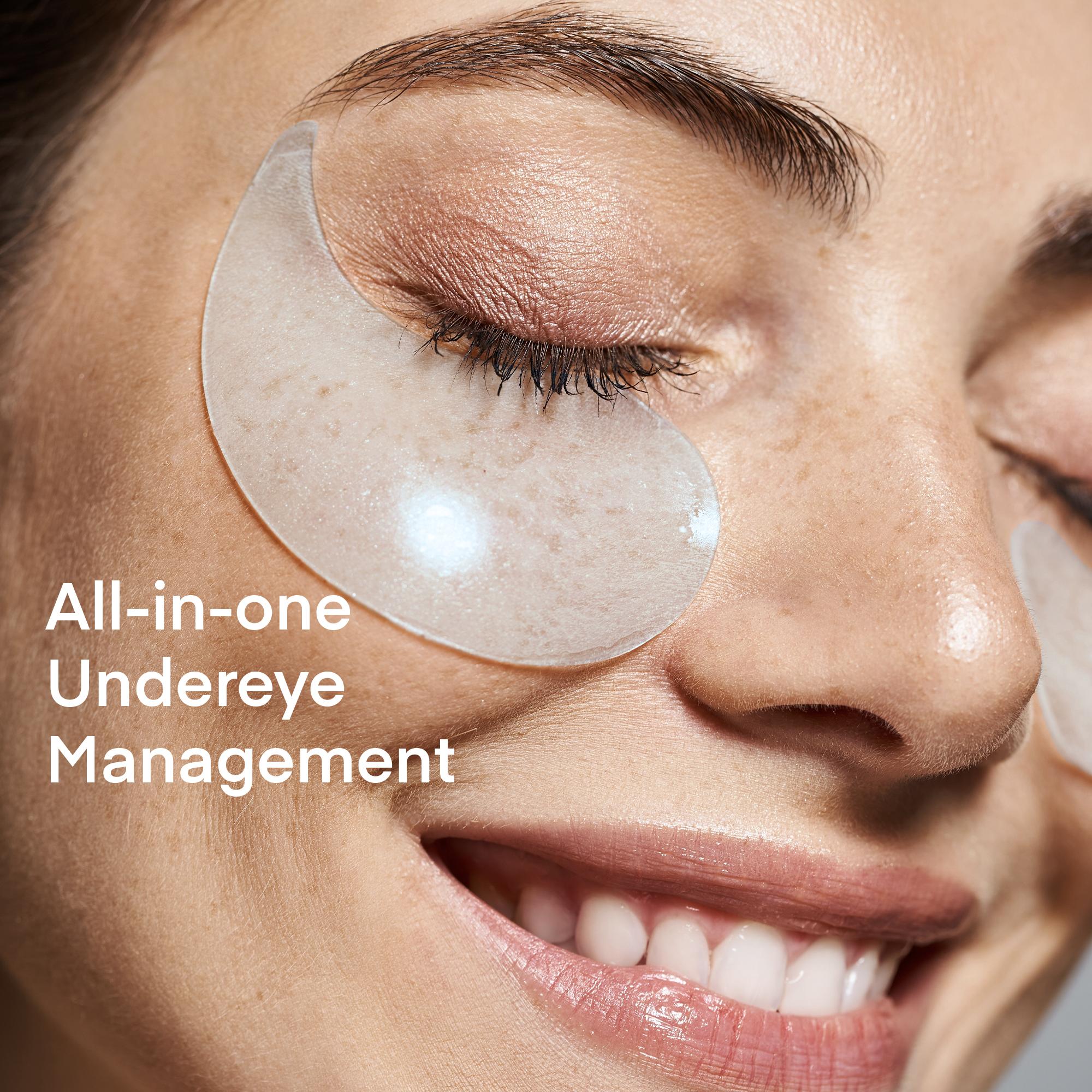 Close-up of a smiling woman with a translucent Terez & Honor under eye patches under her eye, highlighting the all-in-one under-eye management